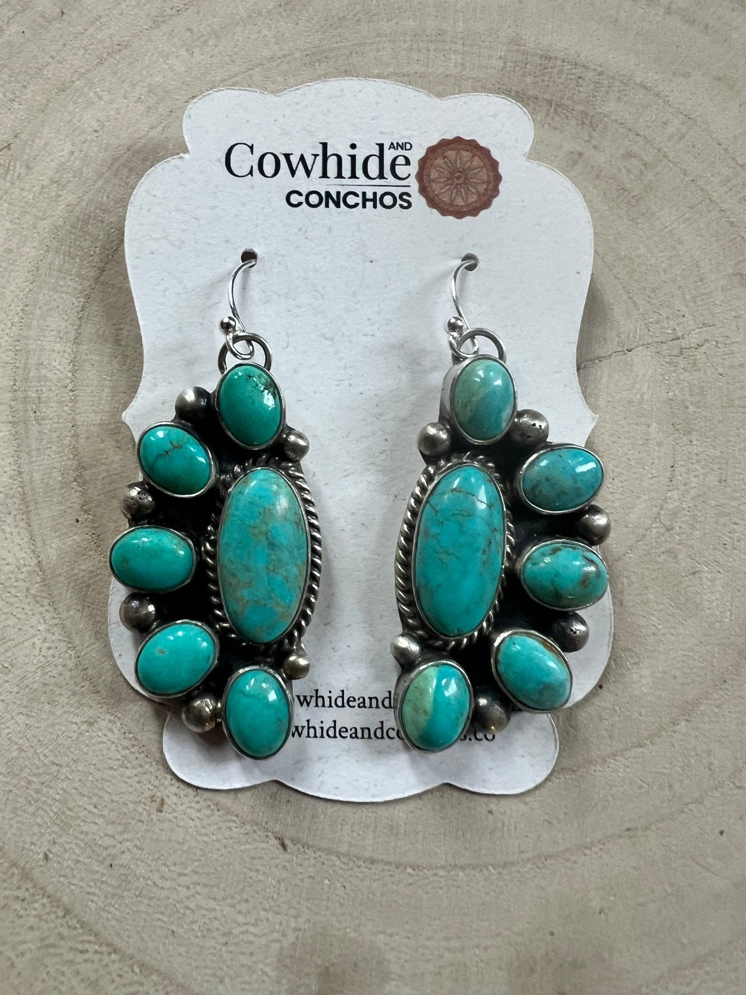 Kathleen Livingston Navajo Sterling Silver Earrings with Sonoran Gem Turquoise — 2" × 3/4" (Hallmarked) - Cowhide and Conchos
