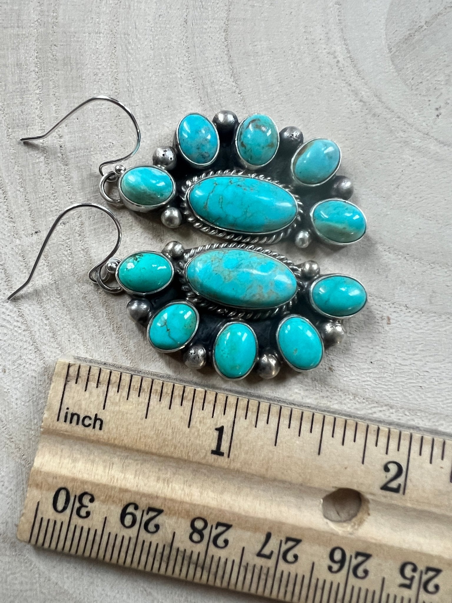 Kathleen Livingston Navajo Sterling Silver Earrings with Sonoran Gem Turquoise — 2" × 3/4" (Hallmarked) - Cowhide and Conchos