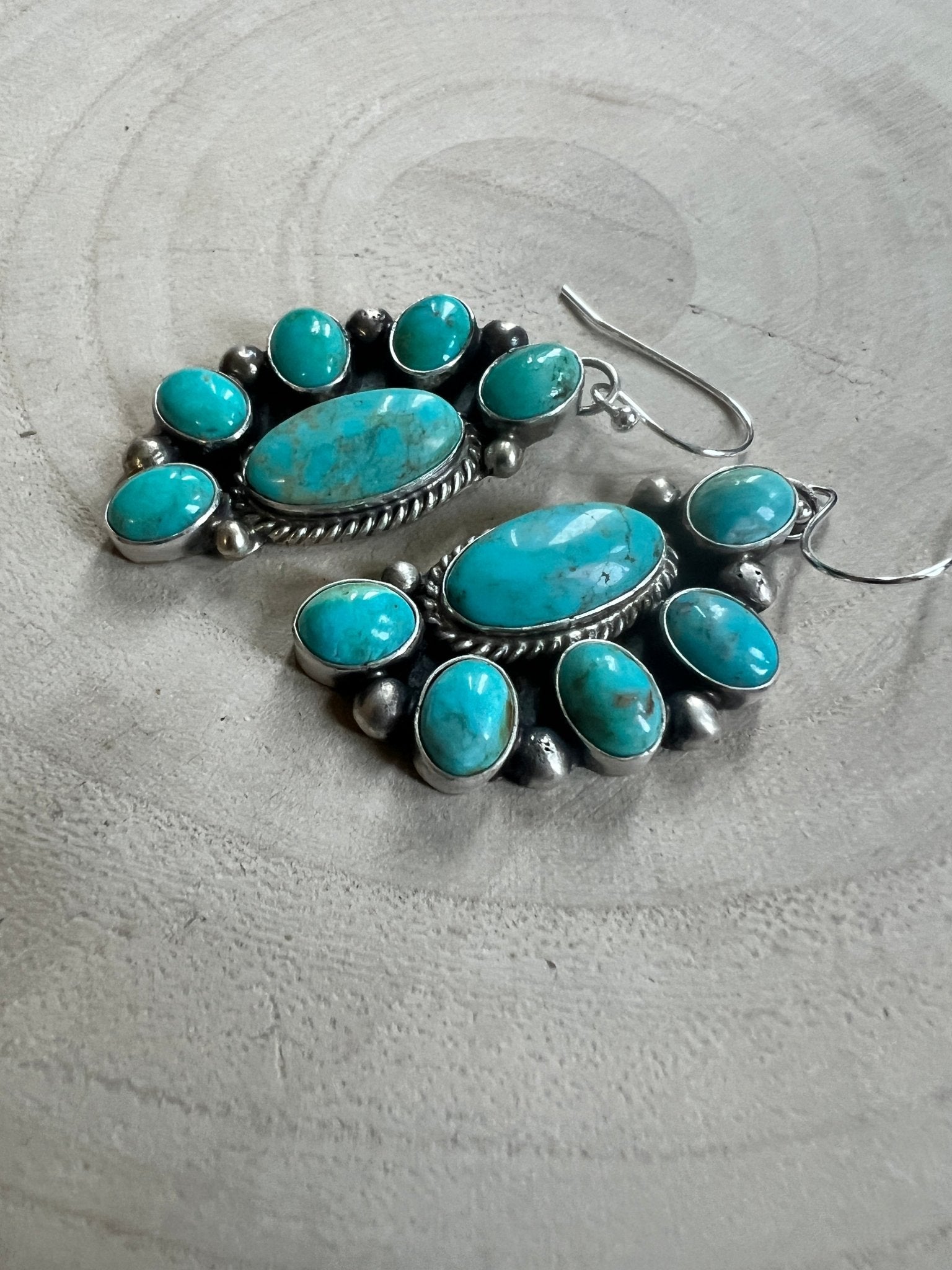 Kathleen Livingston Navajo Sterling Silver Earrings with Sonoran Gem Turquoise — 2" × 3/4" (Hallmarked) - Cowhide and Conchos