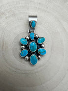 Kathleen Livingston Navajo Sterling Silver Pendant with Sonoran Gem Turquoise — 1 3/4" × 7/8" (Hallmark) - Cowhide and Conchos