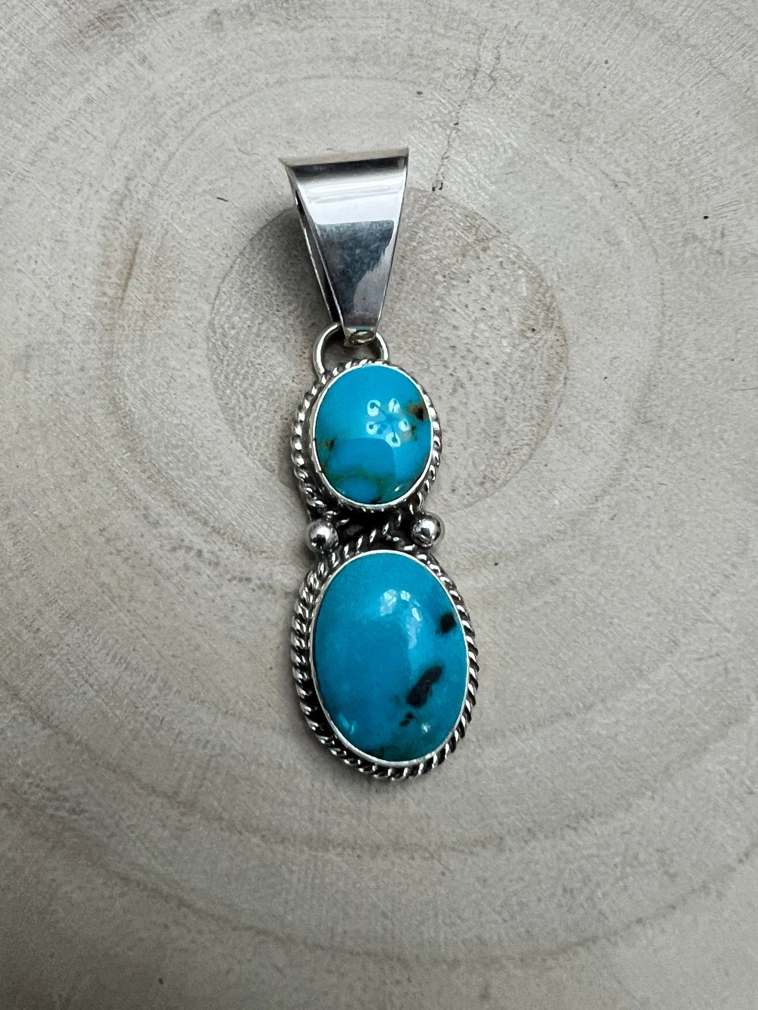 Kathleen Livingston Navajo Sterling Silver Pendant with Sonoran Gem Turquoise — 2" × 1/2" (Hallmarked) - Cowhide and Conchos