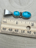 Kathleen Livingston Navajo Sterling Silver Pendant with Sonoran Gem Turquoise — 2" × 1/2" (Hallmarked) - Cowhide and Conchos