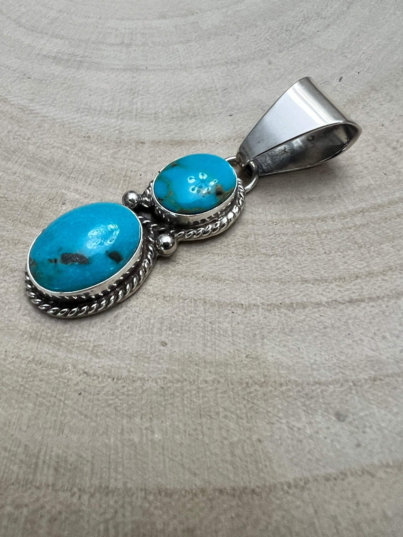 Kathleen Livingston Navajo Sterling Silver Pendant with Sonoran Gem Turquoise — 2" × 1/2" (Hallmarked) - Cowhide and Conchos