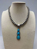 Paul Livingston Turquoise & Sterling Silver Pendant - Cowhide and Conchos
