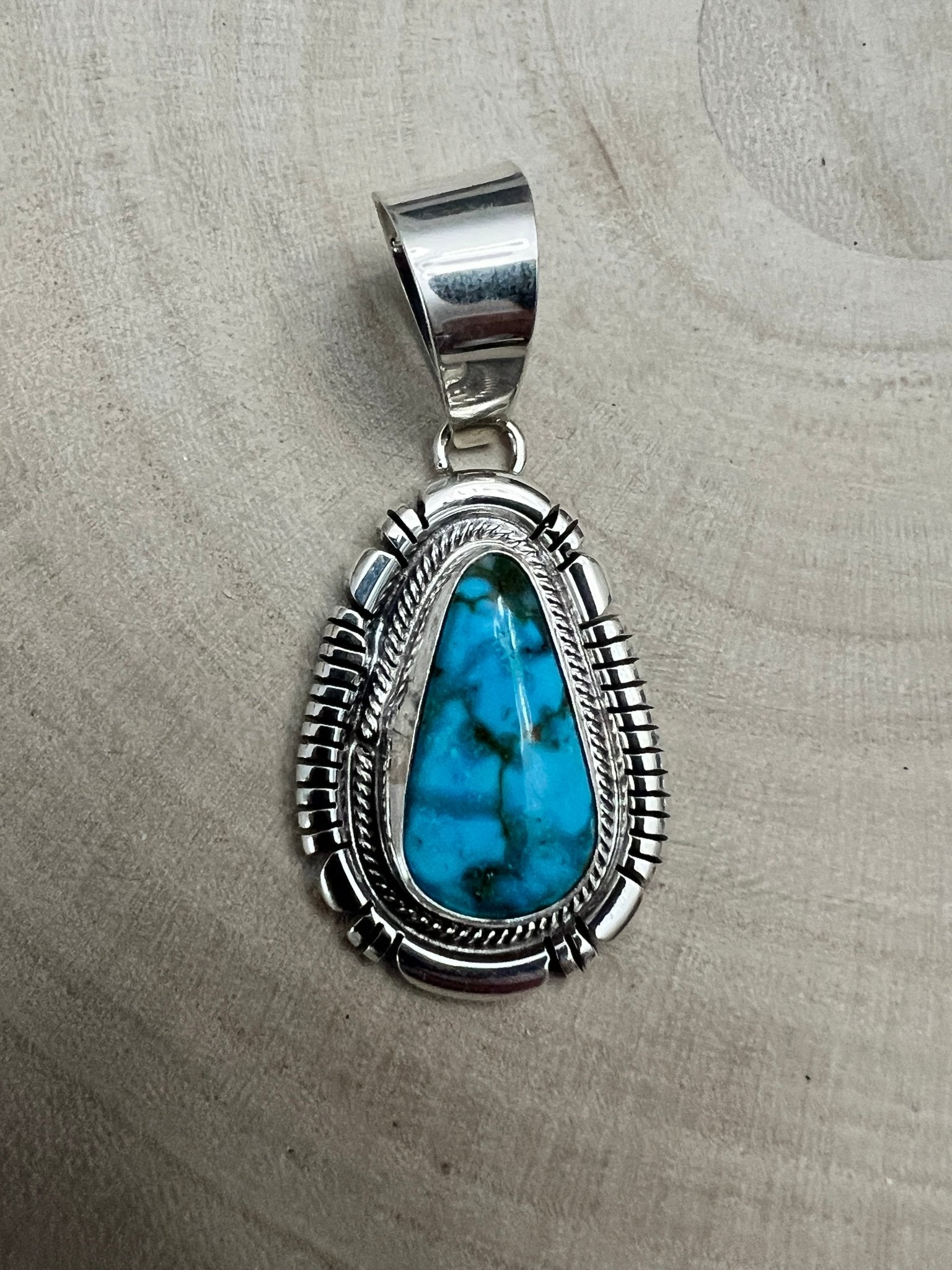 Thomas Francisco Navajo Sterling Silver Pendant with Kingman Turquoise — 2" × 7/8" (Hallmark) - Cowhide and Conchos
