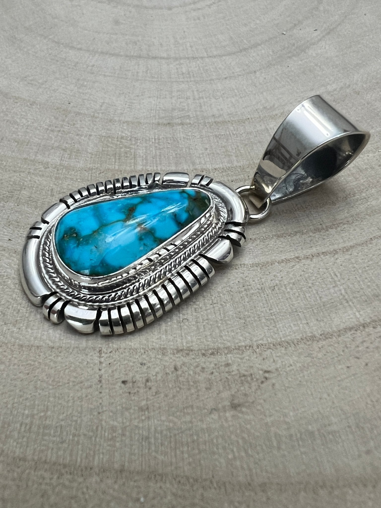 Thomas Francisco Navajo Sterling Silver Pendant with Kingman Turquoise — 2" × 7/8" (Hallmark) - Cowhide and Conchos