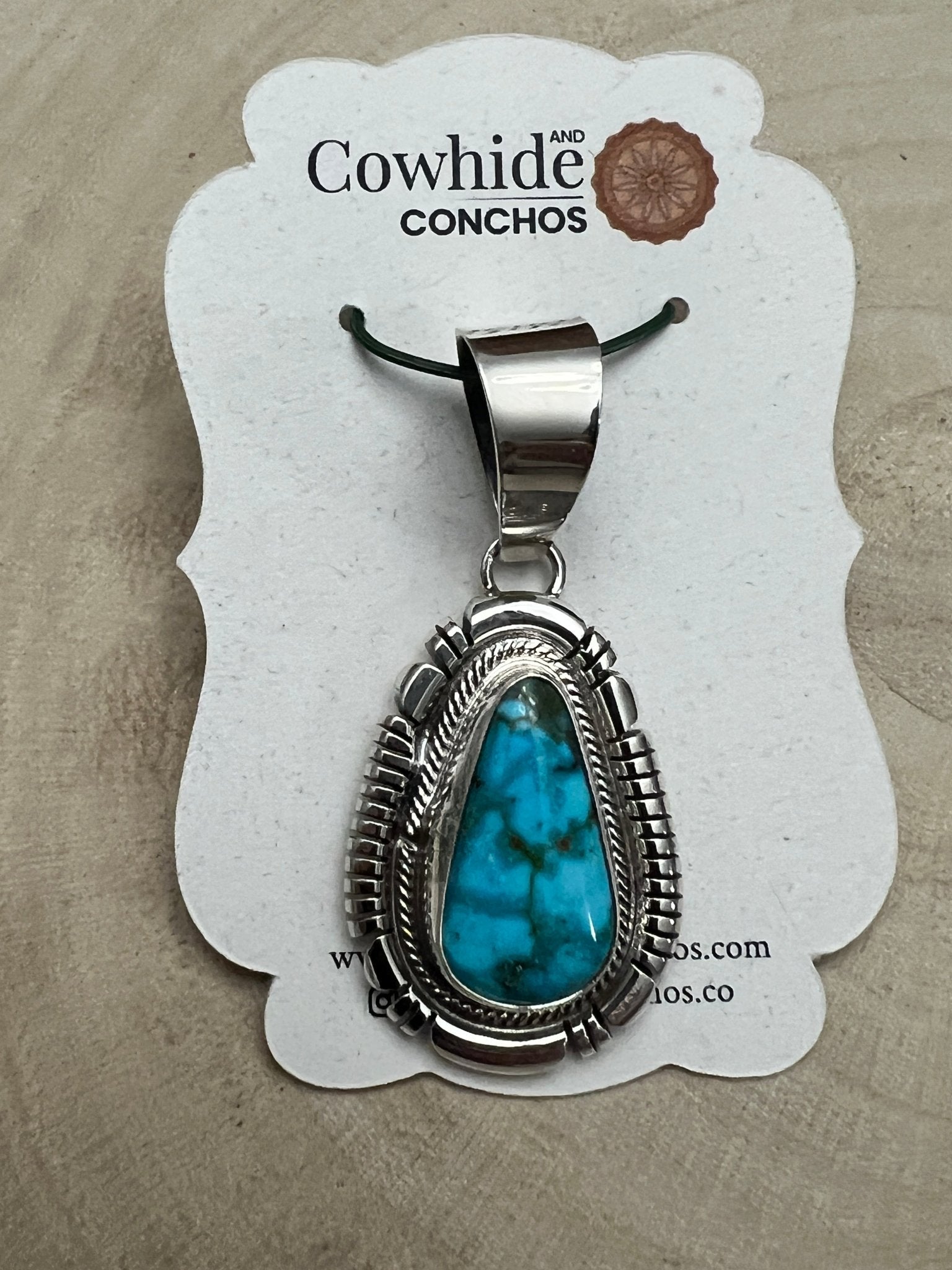 Thomas Francisco Navajo Sterling Silver Pendant with Kingman Turquoise — 2" × 7/8" (Hallmark) - Cowhide and Conchos