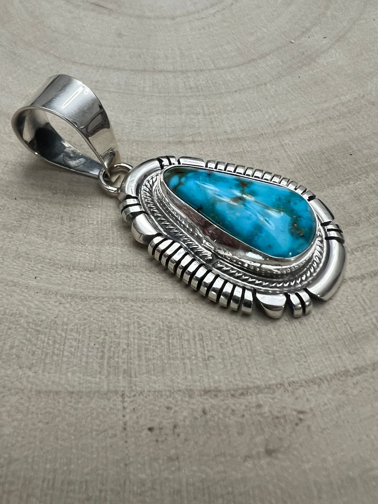 Thomas Francisco Navajo Sterling Silver Pendant with Kingman Turquoise — 2" × 7/8" (Hallmark) - Cowhide and Conchos