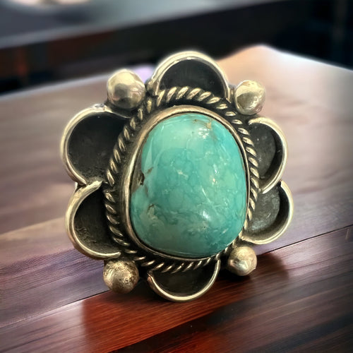 Turquoise ring - gorgeous sky blue cabochon on sterling flower shaped base - Size 7.5
