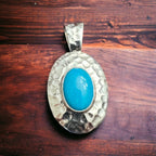 Turquoise pendant - Textured turquoise pendant set on sterling silver - Cowhide and Conchos